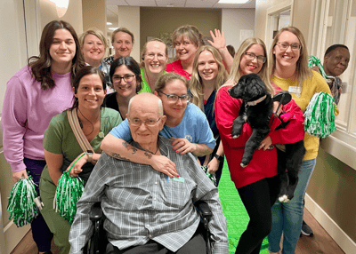 Staff and residents celebrating together in a common area