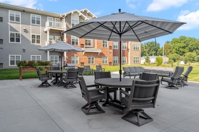 Outdoor seating area with tables and umbrellas