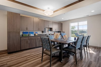 Bright activity room with art displays and dining table