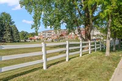 Exterior view of Meadowview of Johnston with a fence and green space