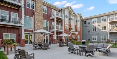 Outdoor seating area with umbrellas and lounge chairs