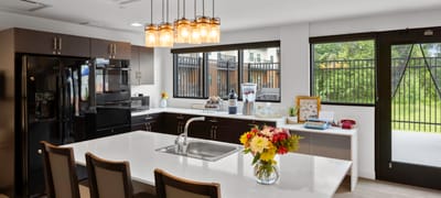 Modern kitchen with a large island and flowers