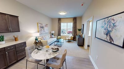 Cozy interior of a private resident room with a dining area