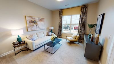 Bright, furnished living room with a modern design