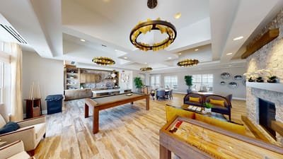 Bright common area with seating and game tables