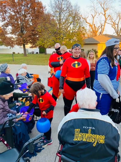 Residents and staff in costume during a community event