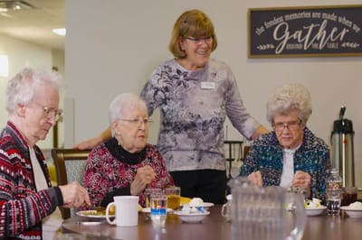Residents enjoying a meal in a dining room