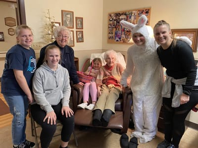 Residents and staff celebrating with the Easter Bunny