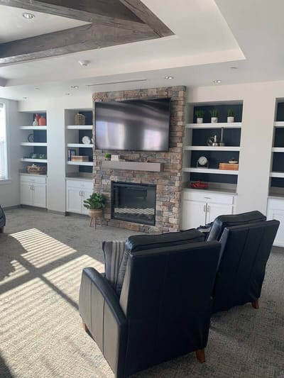 Cozy lounge area with comfortable seating and a TV