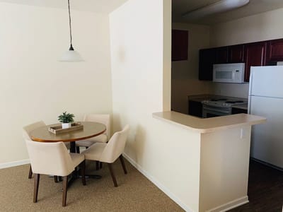 Interior view of a dining area with chairs and table