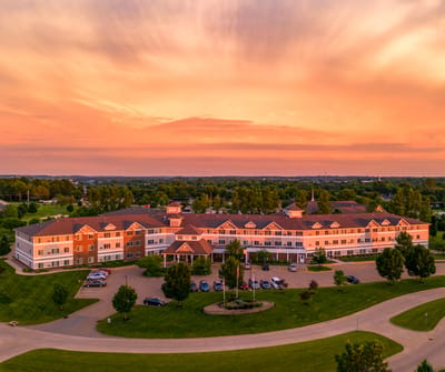 Aerial view of Summit Pointe Senior Living at sunset