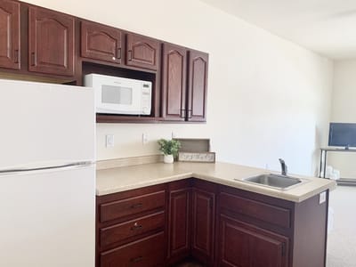 Interior view of a kitchenette with cabinets
