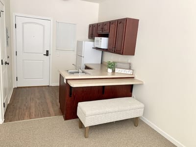 Bright, clean kitchen area in a resident room