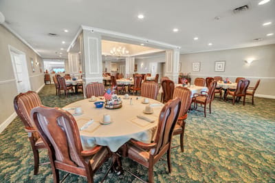 Dining room set with tables and chairs for residents