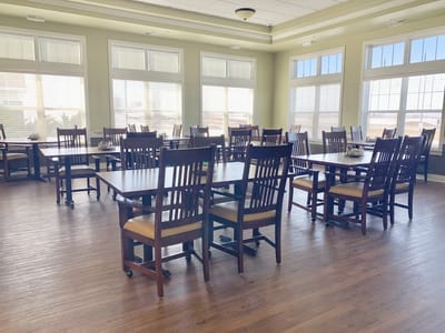 Bright and spacious dining area with wooden tables