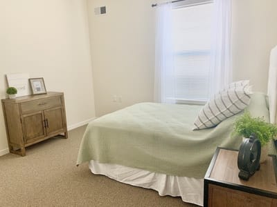 Cozy private resident room with a bed and decor