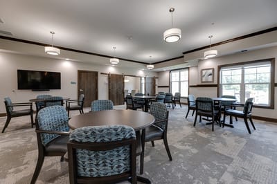 Bright common area with tables and chairs