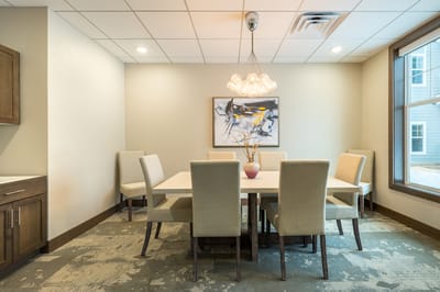 Bright dining area with a large table and modern decor