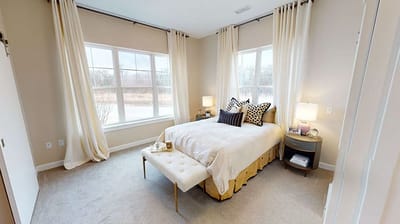 Cozy, well-decorated private bedroom with natural light