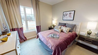 Cozy bedroom setup with natural light and decor