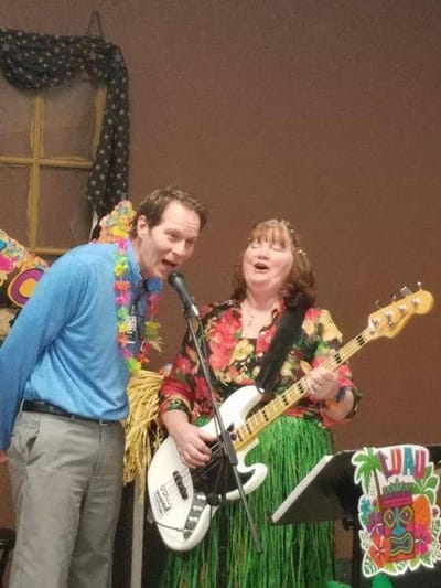 Residents enjoying a live music performance in a common area