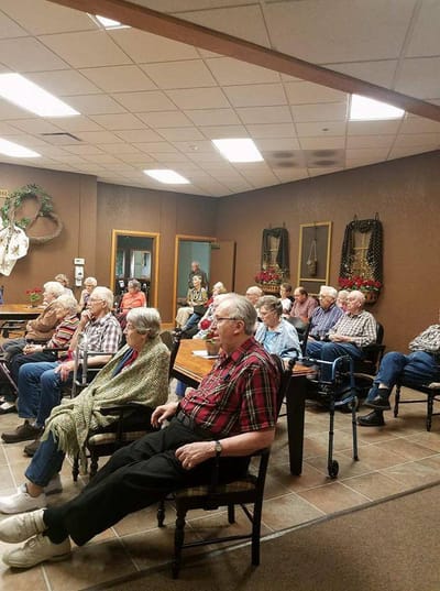 Residents attending a group activity in a common area