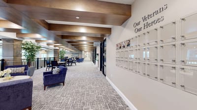 Interior hallway with seating and veteran recognition wall