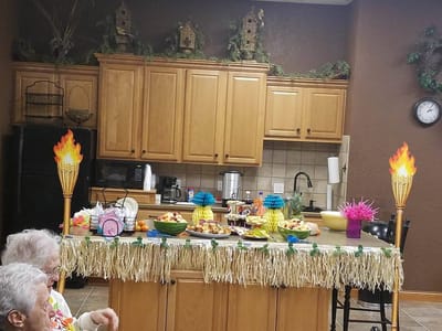 Residents enjoying a festive food display in a common area
