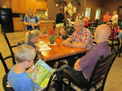 Residents and children engaging in an activity