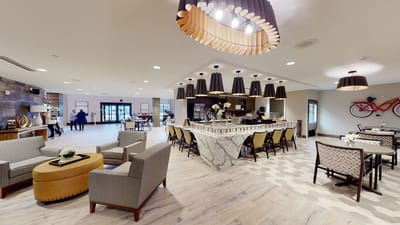 Common area of a senior living facility with residents and staff