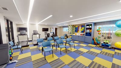 Interior view of a fitness/activity room with equipment