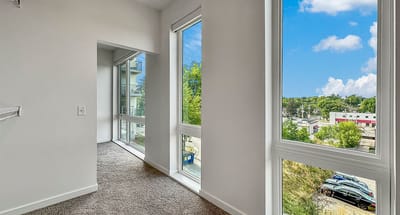 Bright interior room with large windows and scenic view
