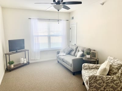 Interior photo of a cozy resident room with furnishings