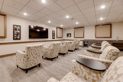 Cozy and well-lit media room with seating