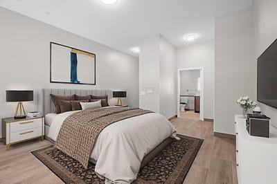 Spacious bedroom with modern decor in a senior living facility