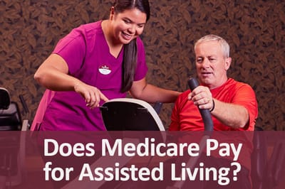 Staff assisting a resident with exercise equipment