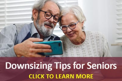 Two seniors looking at a smartphone together