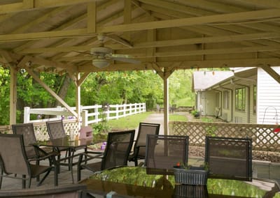 Outdoor seating area with tables and chairs