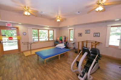 Therapy room with exercise equipment and rehabilitation setup