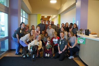 Group of staff and residents in a common area