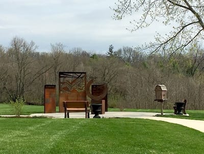 Outdoor space with benches and sculptures