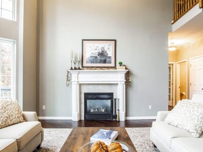 Bright interior common area with seating and fireplace