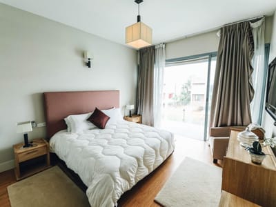 Cozy bedroom with modern furnishings and natural light