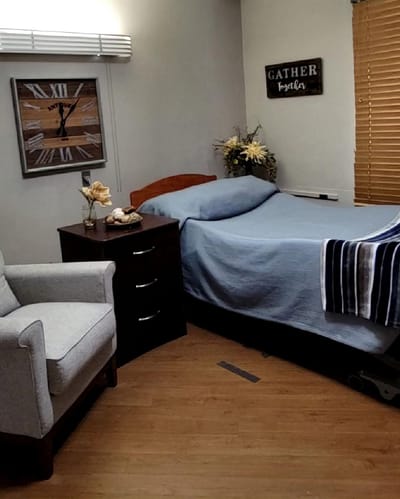 Cozy private resident room with bed and chair