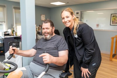 Resident engaging in therapy with staff member