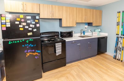 Interior kitchen space with appliances and cabinets