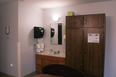 Private resident room interior with basic furniture and amenities