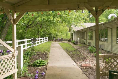 Pathway leading to the building with outdoor seating