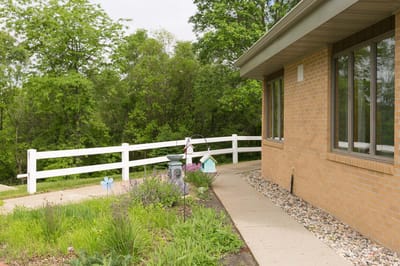 Outdoor view of a pathway and garden near the facility