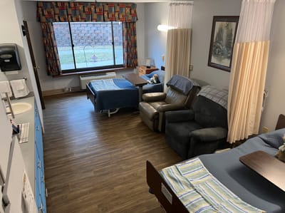 Shared resident room with two beds and a window